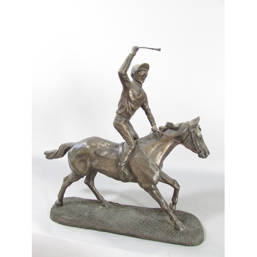 613 - “First, second and third” a group of three bronze resin race horse and jockey studies, approximately... 