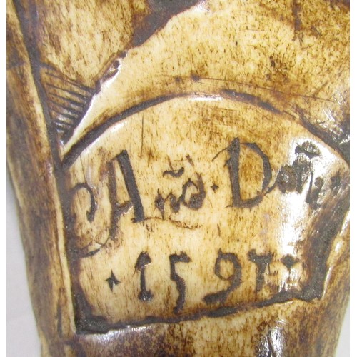 627 - A scrimshaw decorated section of an antler, 14cm high, together with another engraved with a couple ... 