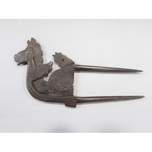 631 - A 19th century stylised dragon Betel leaf cutter, an Asian counterintuitive ironwork lock, an antiqu... 