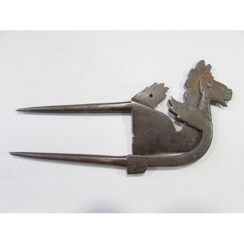 631 - A 19th century stylised dragon Betel leaf cutter, an Asian counterintuitive ironwork lock, an antiqu... 