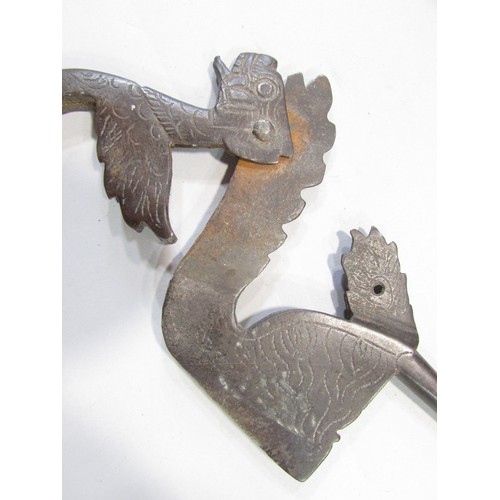 631 - A 19th century stylised dragon Betel leaf cutter, an Asian counterintuitive ironwork lock, an antiqu... 