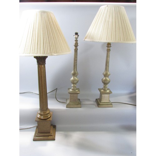 621 - A single Corinthian column table lamp and a pair of candlestick column table lamps and shades, each ... 