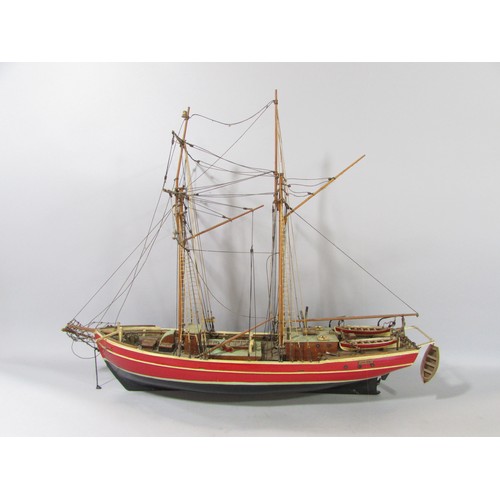 622 - A highly detailed wooden model of a square rigged schooner name Lilla Dan (as found) 60cm long.