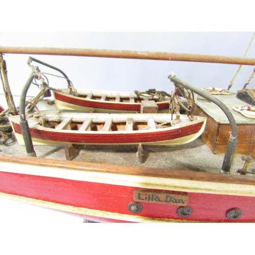 622 - A highly detailed wooden model of a square rigged schooner name Lilla Dan (as found) 60cm long.