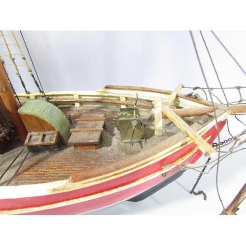 622 - A highly detailed wooden model of a square rigged schooner name Lilla Dan (as found) 60cm long.