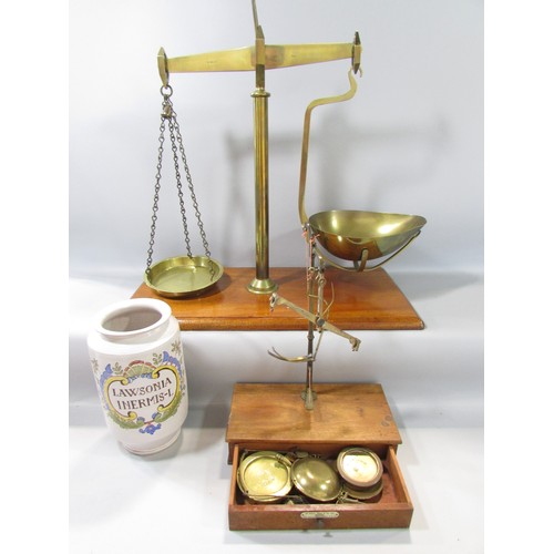 623 - A 19th century set of brass scales on a mahogany stand with a single drawer, made by Ge Grave, Short... 