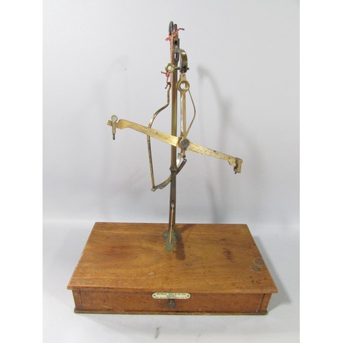 623 - A 19th century set of brass scales on a mahogany stand with a single drawer, made by Ge Grave, Short... 