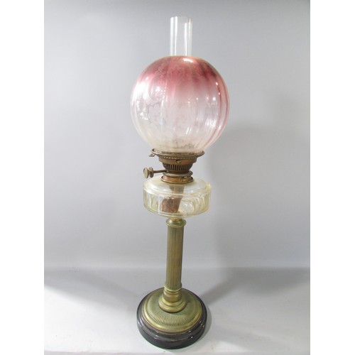 638 - A Victorian reeded brass column oil lamp with receding purple glass shade and Hinks No 2 lever, 65cm... 