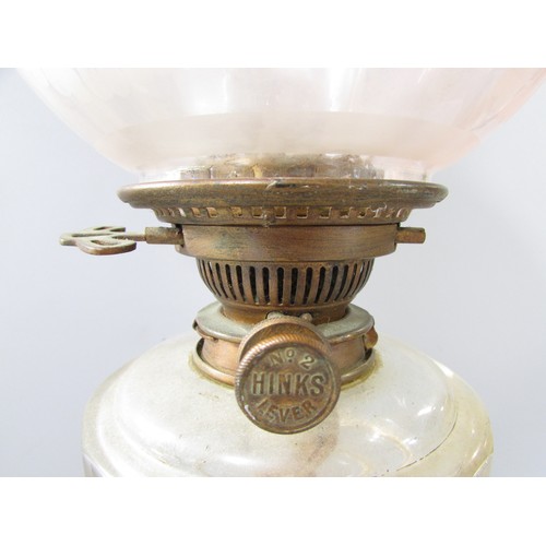 638 - A Victorian reeded brass column oil lamp with receding purple glass shade and Hinks No 2 lever, 65cm... 