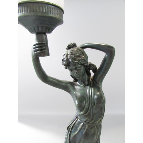 640 - A bronzed effect table lamp of a Classical draped woman arm aloft with lamp and solitary naked infan... 