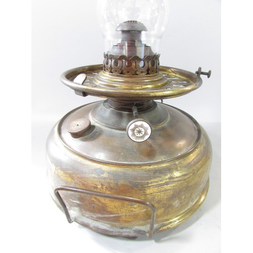 641 - A Victorian Globe Stove with a Union Burner, a cranberry glass diamond cut shade with a polished bra... 