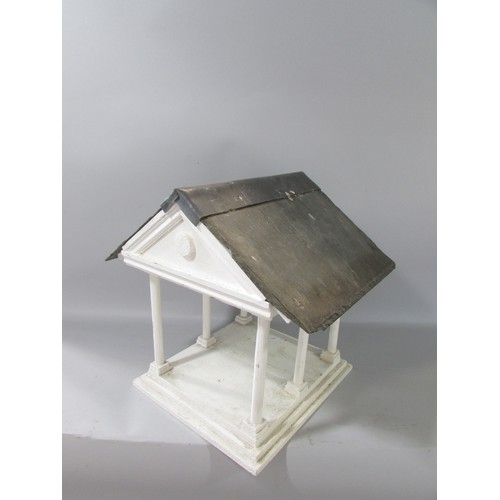 646 - A vintage Portico bird table with a slate and lead roof. 31cm high