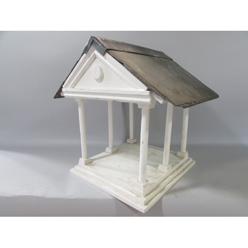 646 - A vintage Portico bird table with a slate and lead roof. 31cm high