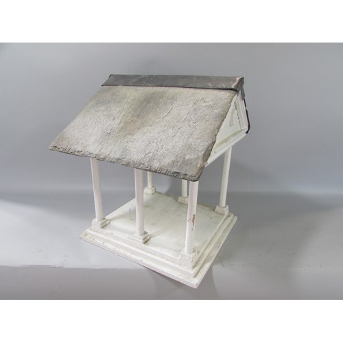 646 - A vintage Portico bird table with a slate and lead roof. 31cm high