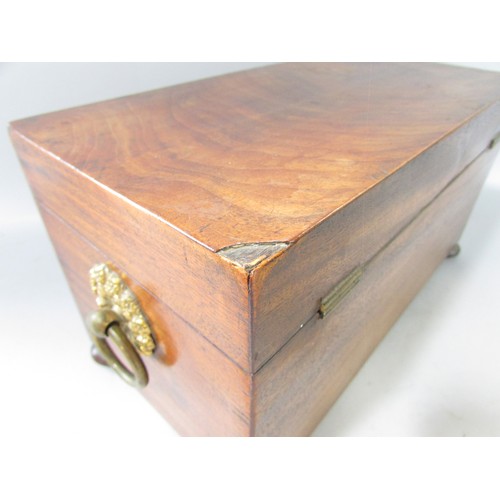 645 - A Georgian mahogany tea caddy open to reveal two wooden caddies and a glass mixing bowl, ring handle... 