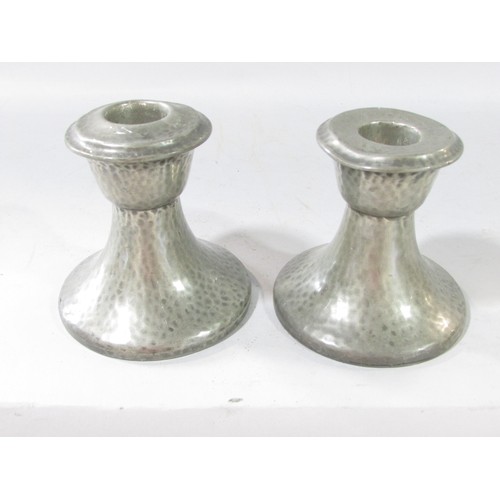 650 - A pair of 19th century pewter candlesticks 21cm high and a squat pair of lightly hammered candlestic... 