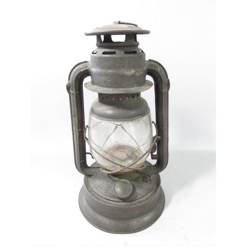 653 - A 19th century Bat No 450 storm lamp with swing handle, 35cm high.