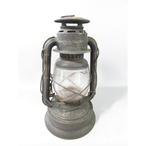 653 - A 19th century Bat No 450 storm lamp with swing handle, 35cm high.