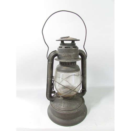 653 - A 19th century Bat No 450 storm lamp with swing handle, 35cm high.