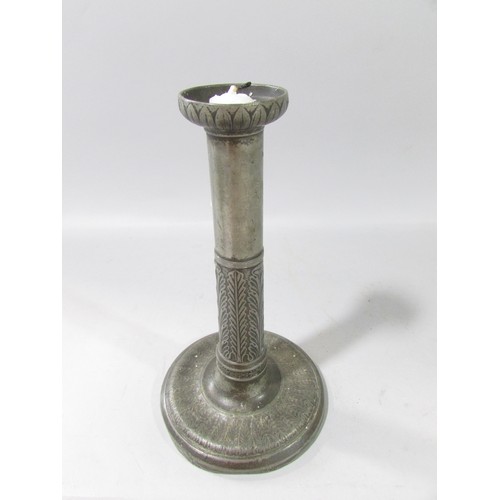 656 - A 19th century Lignum tobacco pot and cover and a pewter candlestick.