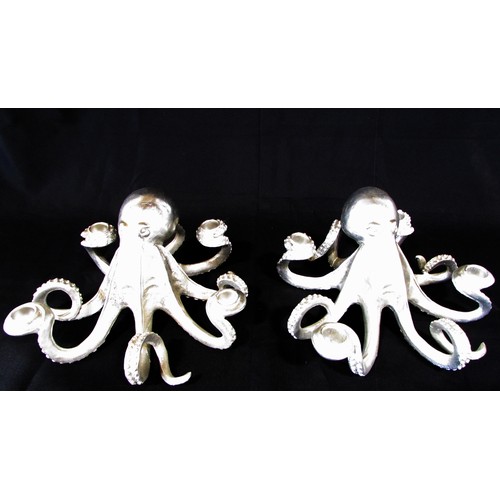 657 - A pair of novelty silver tone octopus table centre candle holders, each holding four candles, 30cm d... 