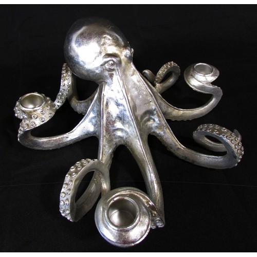 657 - A pair of novelty silver tone octopus table centre candle holders, each holding four candles, 30cm d... 