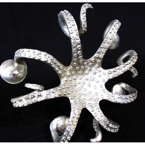 657 - A pair of novelty silver tone octopus table centre candle holders, each holding four candles, 30cm d... 