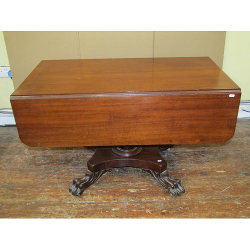 1610 - A Regency mahogany Pembroke breakfast table on platform base with lions paw feet, 75cm high x 115cm ... 