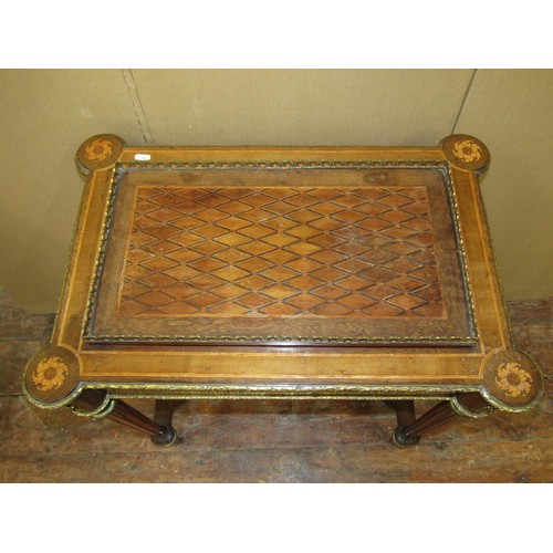 1611 - A 19th century French occasional table with geometric marquetry finish on reeded supports united by ... 