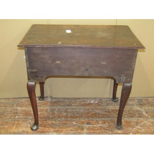 1612 - A Georgian oak countrymade lowboy of three drawers, raised on four pad feet, 71cm high x 79cm wide x... 