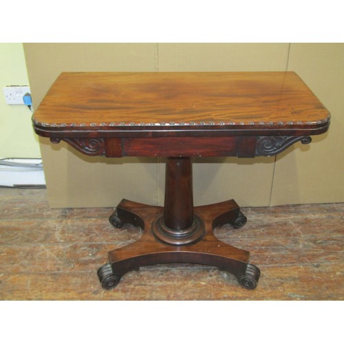 1615 - A Regency mahogany fold over top card table on turned pillar and platform base, 75cm high x 90cm wid... 