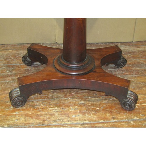 1615 - A Regency mahogany fold over top card table on turned pillar and platform base, 75cm high x 90cm wid... 