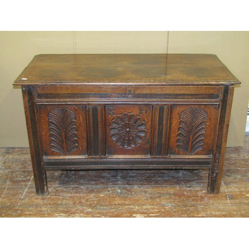 1619 - A 17th century oak coffer of neat proportions, with carved detail, 65cm high x 110cm wide x 50cm dee... 