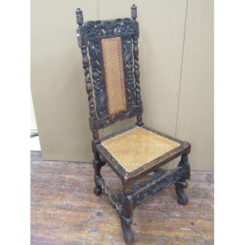 1620 - Set of eight Carolean style dining chairs in oak, with traditional carving and caned panel seats and... 