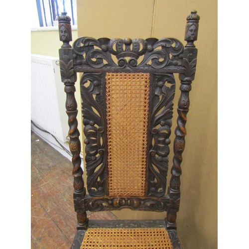 1620 - Set of eight Carolean style dining chairs in oak, with traditional carving and caned panel seats and... 