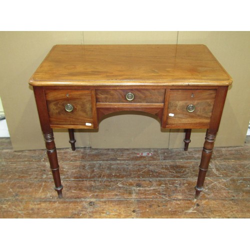 1621 - A Victorian mahogany writing table enclosing three drawers on turned supports, 75cm high x 90cm wide... 