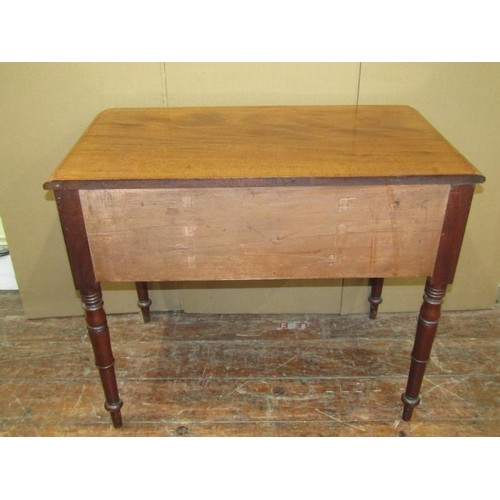 1621 - A Victorian mahogany writing table enclosing three drawers on turned supports, 75cm high x 90cm wide... 