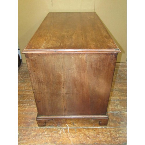 1622 - A Georgian mahogany kneehole desk enclosing eight drawers, the top drawer with fitted interior, with... 