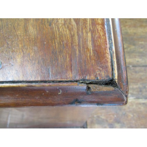 1622 - A Georgian mahogany kneehole desk enclosing eight drawers, the top drawer with fitted interior, with... 