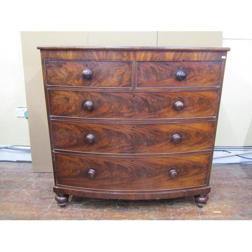 1624 - An early Victorian mahogany bow fronted chest of three long and two short drawers with well matched ... 