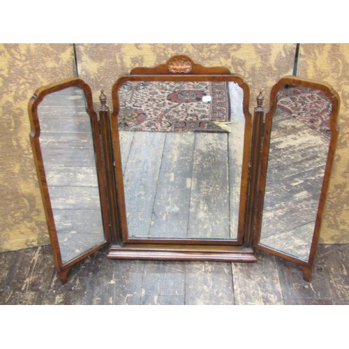 1625 - A Queen Anne style triple mirror, in a walnut frame on platform base