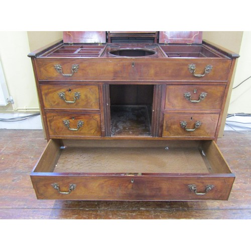 1626 - A George III mahogany country-house washstand, the rising lid enclosing a fitted interior of compart... 