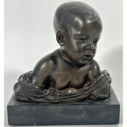 679 - A bronze bust of a baby, in loose swaddling, set on a marble plinth, by Antonio Teixeira Lopes, sign... 