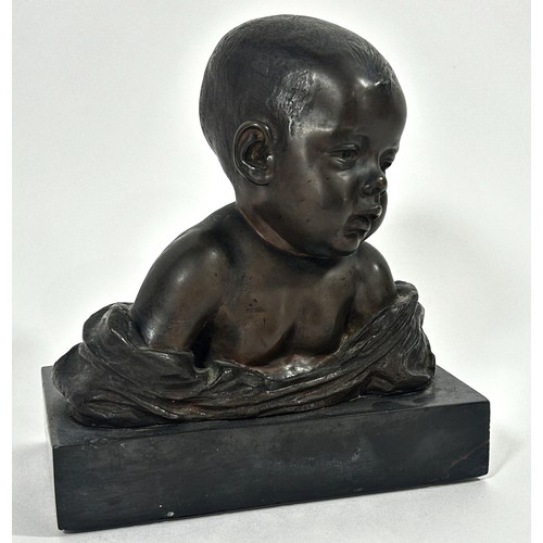 679 - A bronze bust of a baby, in loose swaddling, set on a marble plinth, by Antonio Teixeira Lopes, sign... 