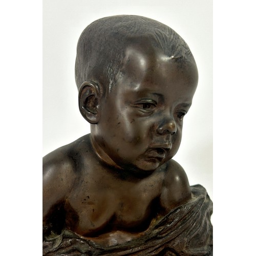 679 - A bronze bust of a baby, in loose swaddling, set on a marble plinth, by Antonio Teixeira Lopes, sign... 