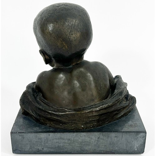 679 - A bronze bust of a baby, in loose swaddling, set on a marble plinth, by Antonio Teixeira Lopes, sign... 