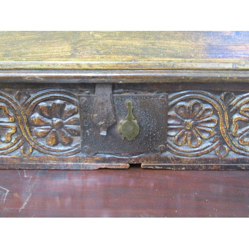 1636 - An 18th century oak writing slope with painted detail, the rising lid revealing a fitted interior, t... 