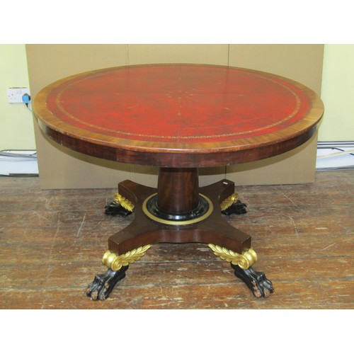 1640 - A regency mahogany centre or library table the circular top inlaid in red gilt tooled leather, raise... 