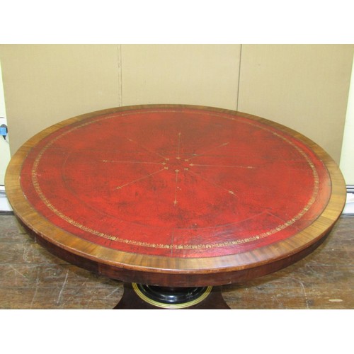 1640 - A regency mahogany centre or library table the circular top inlaid in red gilt tooled leather, raise... 