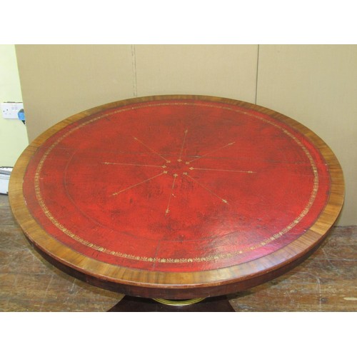 1640 - A regency mahogany centre or library table the circular top inlaid in red gilt tooled leather, raise... 